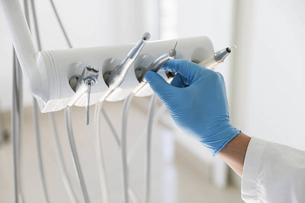 Professional Tooth Extraction technician working in Comstock Northwest, MI